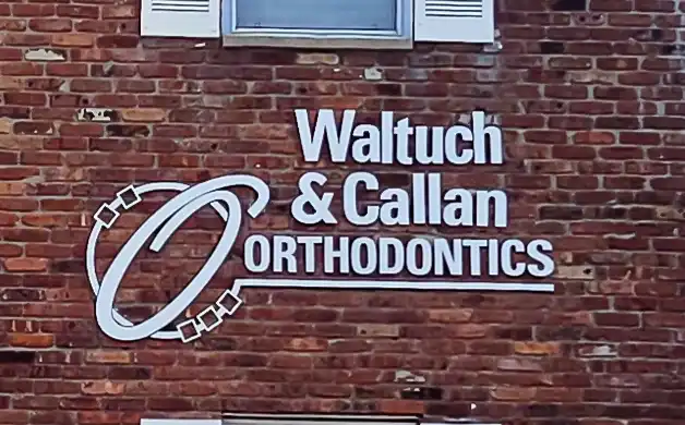 White logo on building